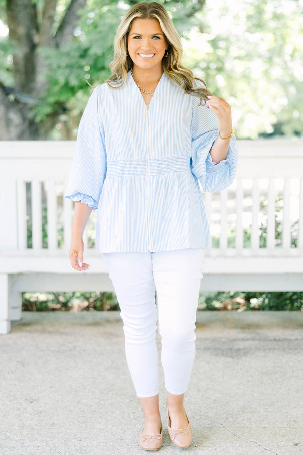 Plus Size light blue and white striped blouse with a zippered front and smocked waist.