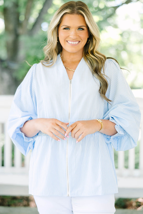 Plus Size light blue and white striped blouse with a zippered front and smocked waist.