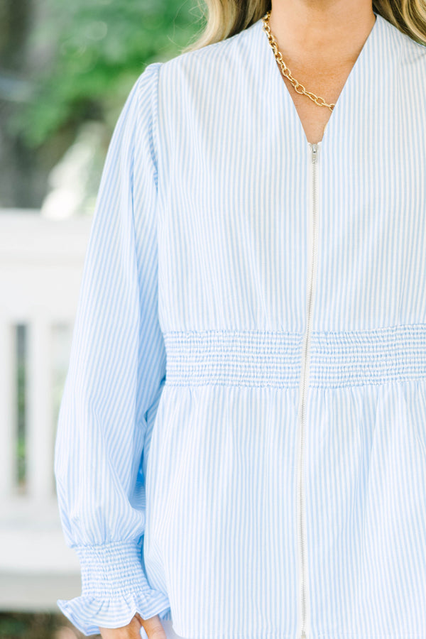 Plus Size light blue and white striped blouse with a zippered front and smocked waist.