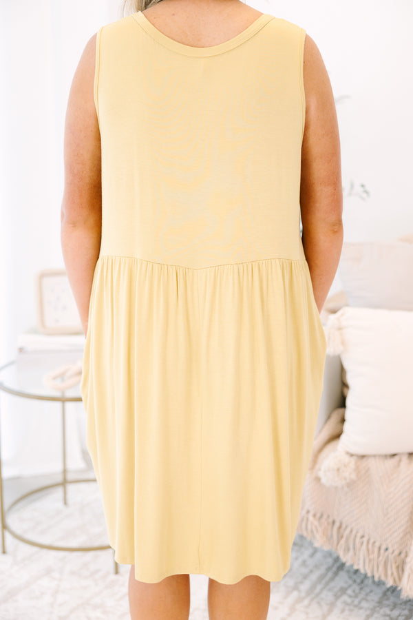 Plus Size lemon sleeveless babydoll dress with a round neckline and side pockets.