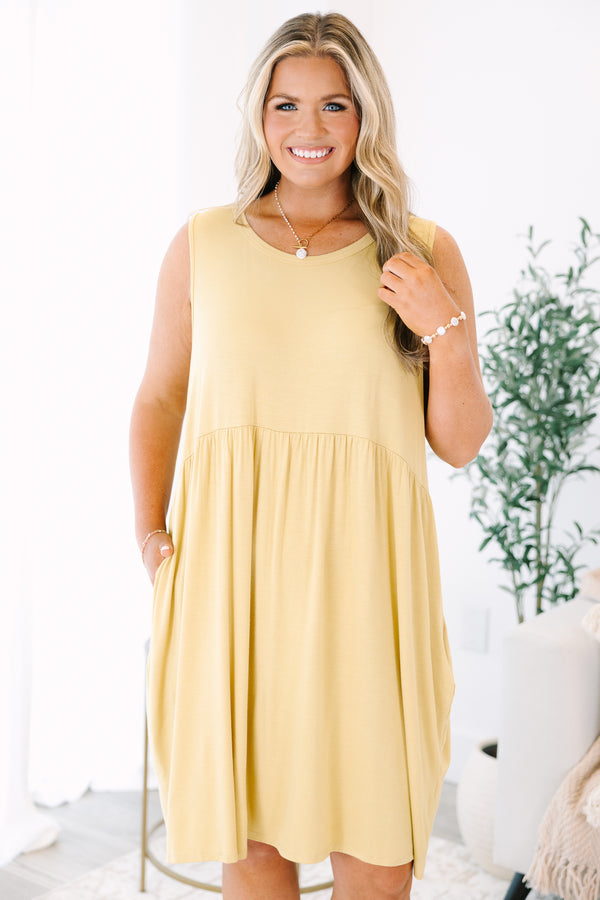 Plus Size lemon sleeveless babydoll dress with a round neckline and side pockets.