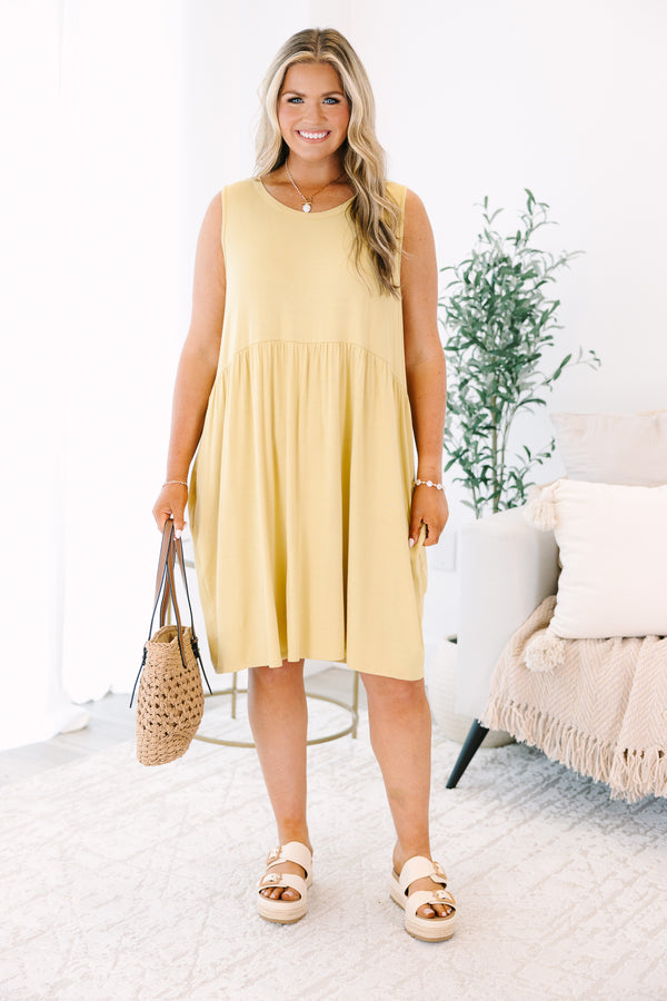 Plus Size lemon sleeveless babydoll dress with a round neckline and side pockets.