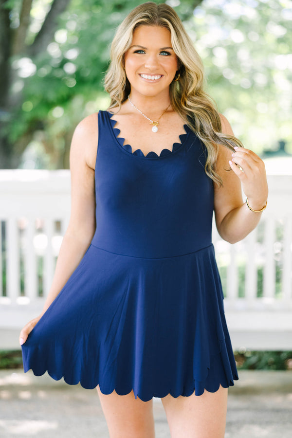 Plus Size navy blue sleeveless dress with a scalloped neckline and a scalloped hemline.
