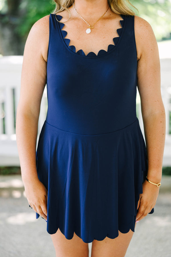 Plus Size navy blue sleeveless dress with a scalloped neckline and a scalloped hemline.