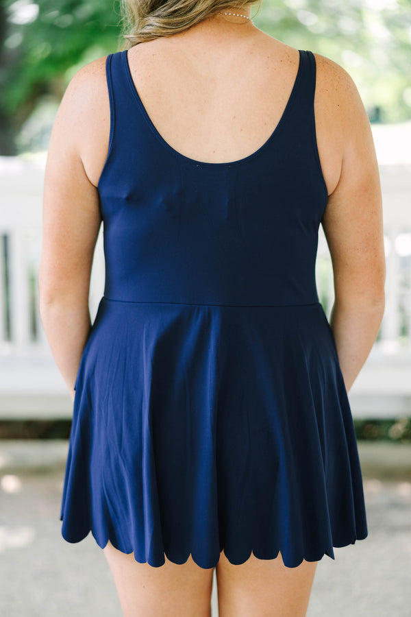 Plus Size navy blue sleeveless dress with a scalloped neckline and a scalloped hemline.