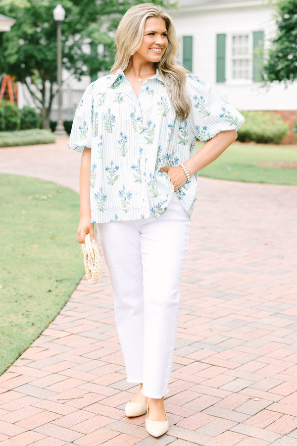 Plus Size blue and white striped button-down top with a floral print and puff sleeves.