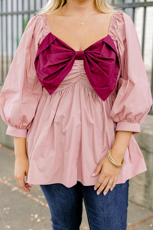 Chic Soul plus size clothing, light pink long sleeve babydoll top with an oversized maroon bow on the chest