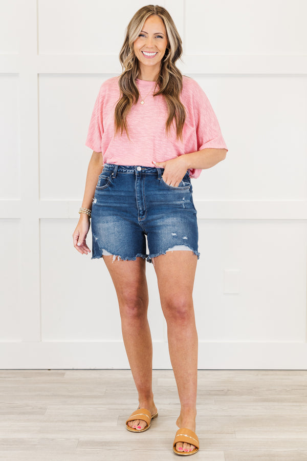 Chic Soul plus size clothing, mid-waisted dark wash distressed denim shorts with a silver button detailing 