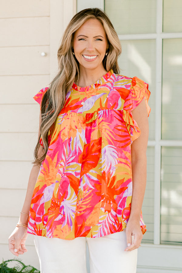 Plus Size tropical floral print top with flutter sleeves and a ruffled neckline.