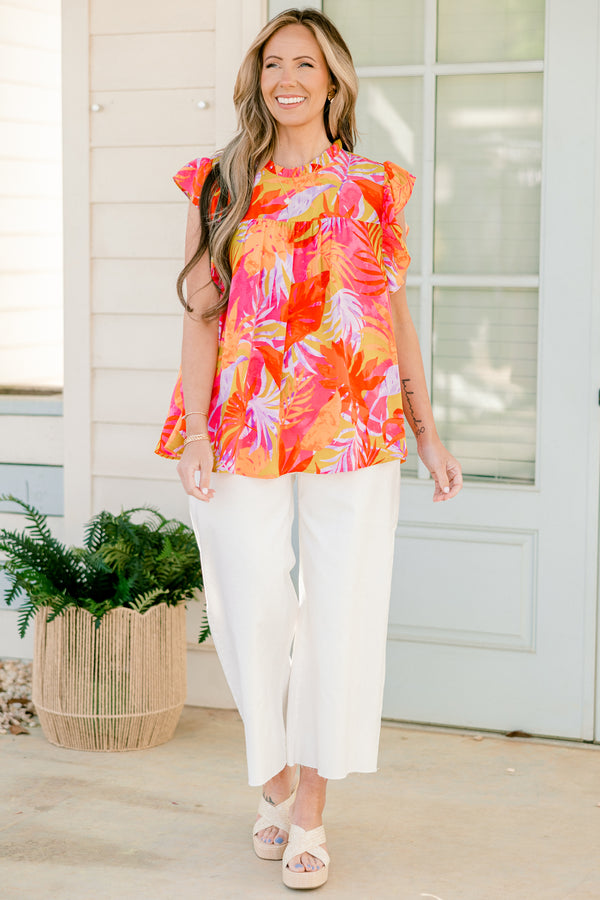 Plus Size tropical floral print top with flutter sleeves and a ruffled neckline.