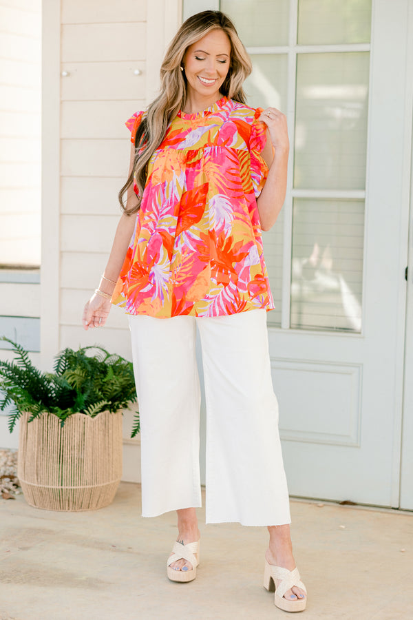 Plus Size tropical floral print top with flutter sleeves and a ruffled neckline.