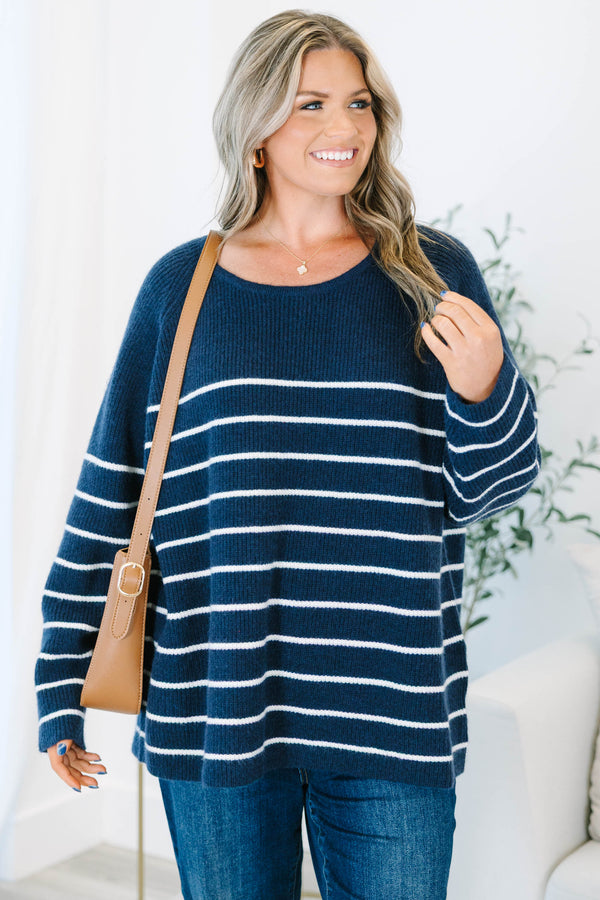 Plus Size navy blue and white horizontal striped sweater with a crew neckline and long sleeves.