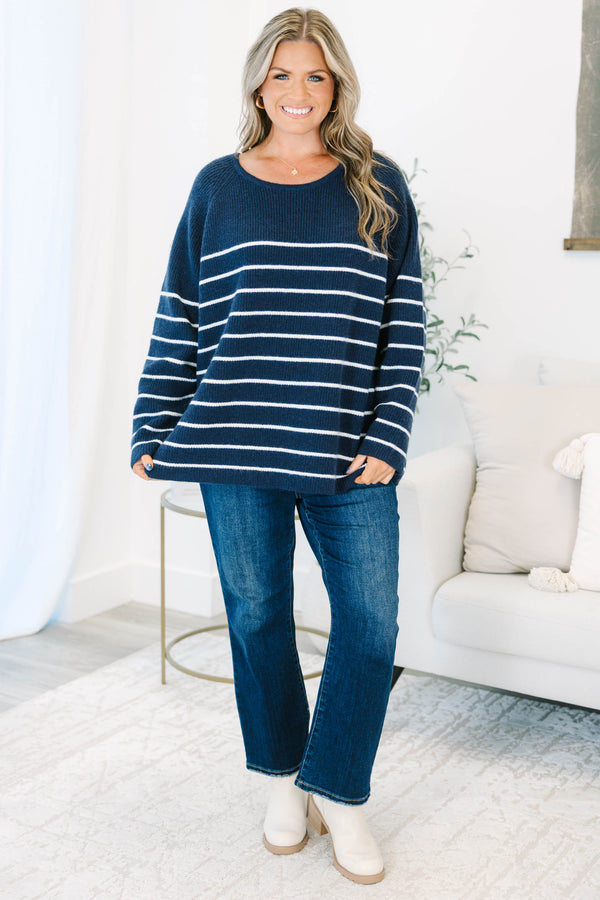 Plus Size navy blue and white horizontal striped sweater with a crew neckline and long sleeves.