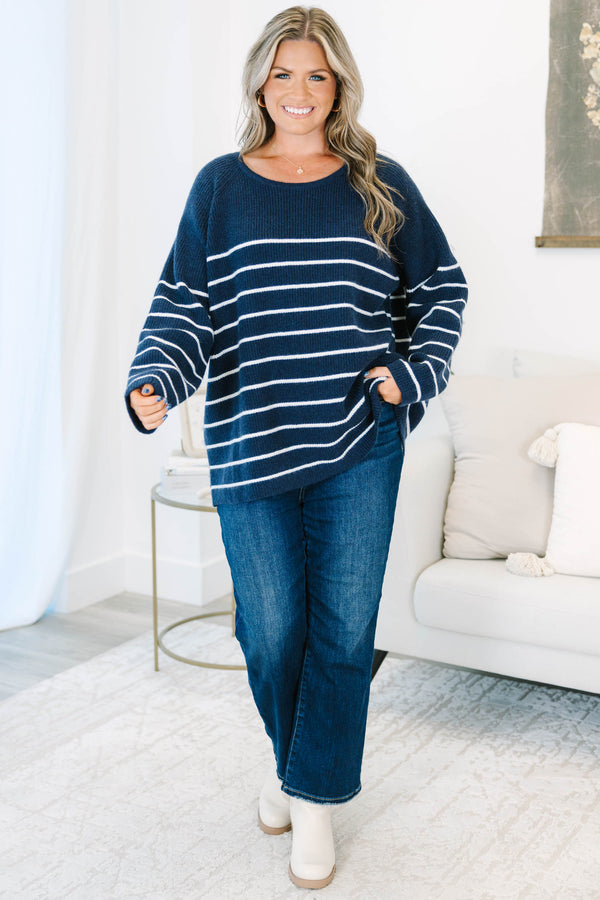 Plus Size navy blue and white horizontal striped sweater with a crew neckline and long sleeves.