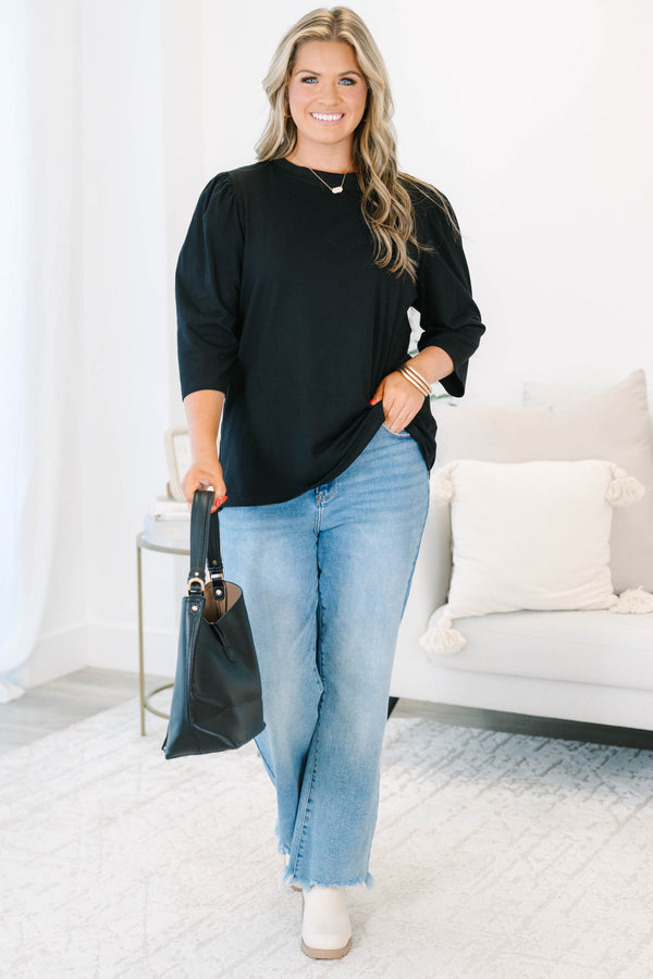 Plus Size black crew neck top with three quarter sleeves and a relaxed fit.