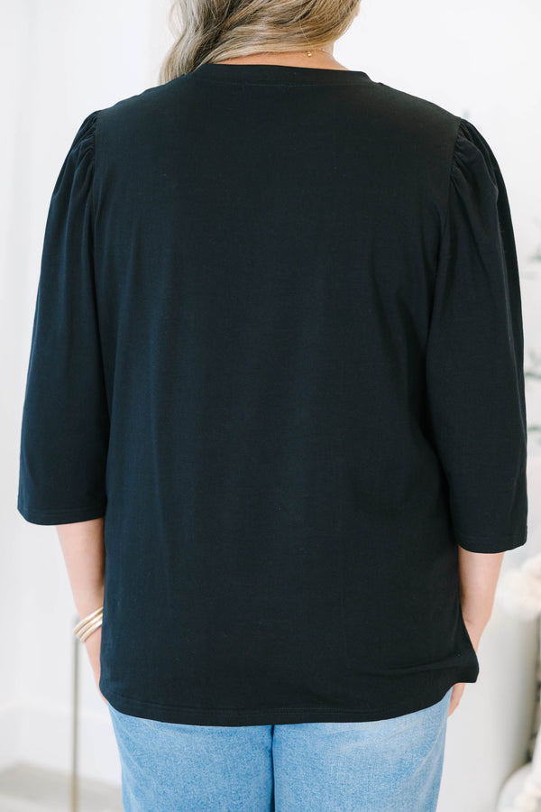 Plus Size black crew neck top with three quarter sleeves and a relaxed fit.