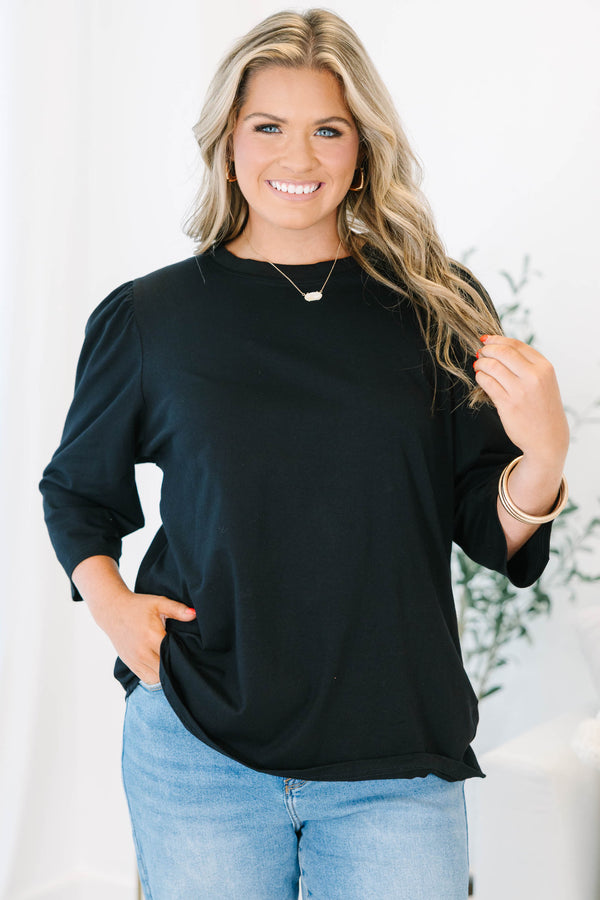 Plus Size black crew neck top with three quarter sleeves and a relaxed fit.