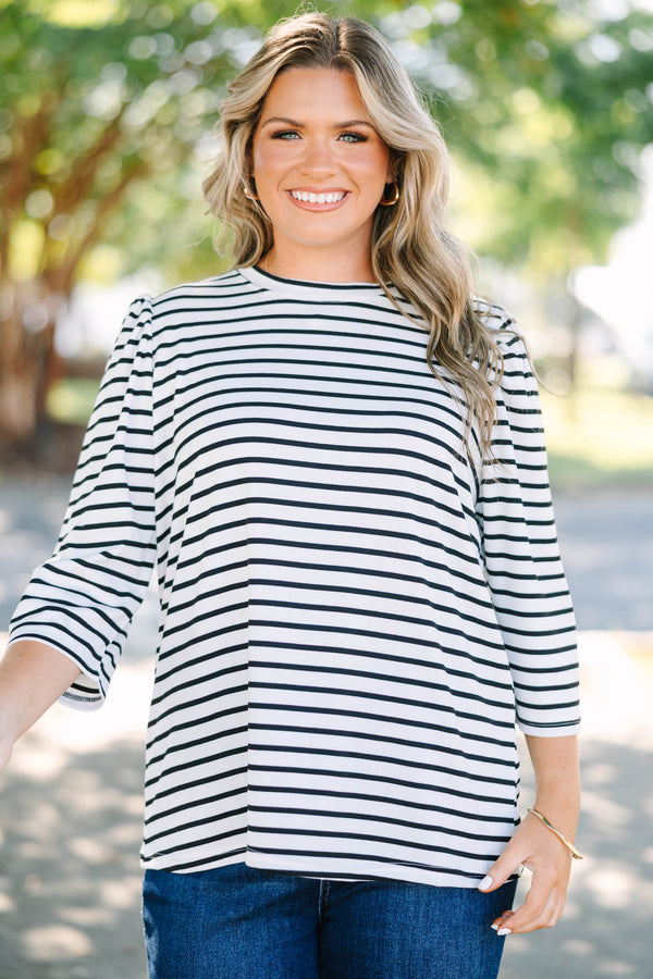 Plus size black and white striped top with 3/4 puff sleeves and a flowy cotton fit.