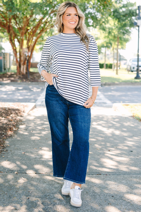 Plus size black and white striped top with 3/4 puff sleeves and a flowy cotton fit.