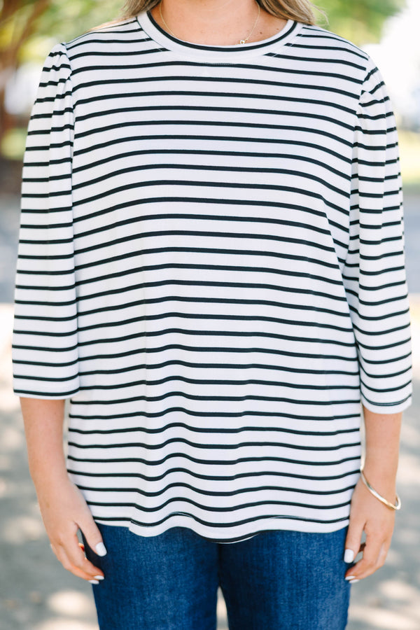 Plus size black and white striped top with 3/4 puff sleeves and a flowy cotton fit.