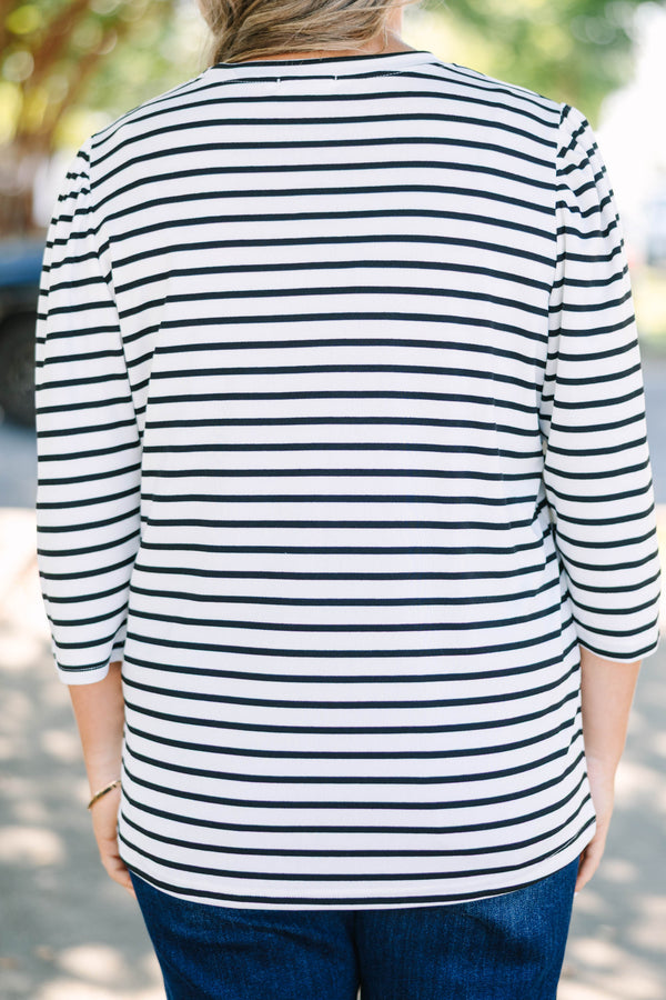 Plus size black and white striped top with 3/4 puff sleeves and a flowy cotton fit.