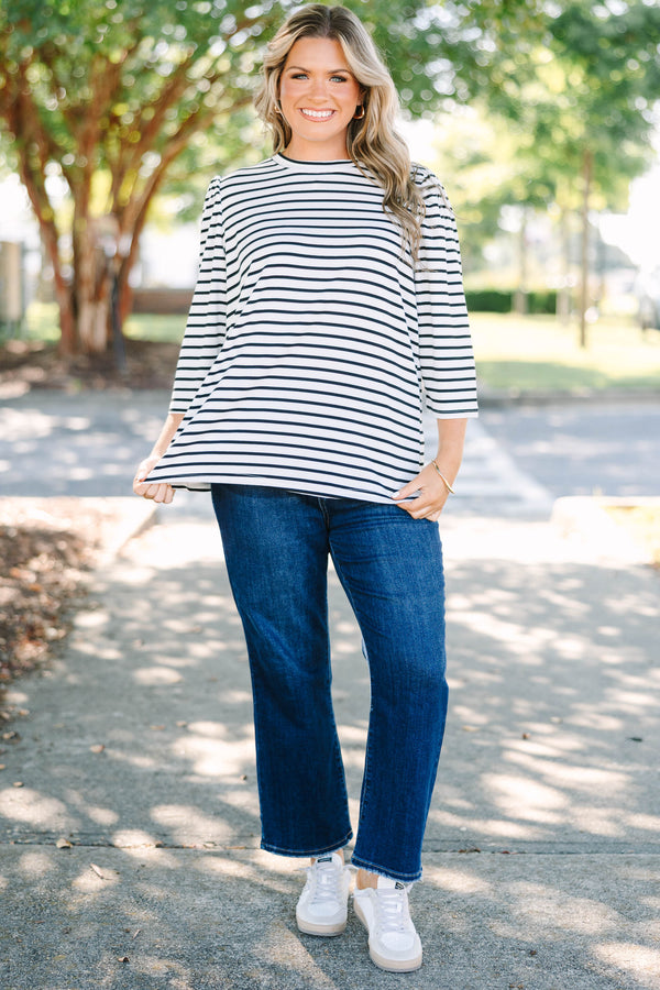 Plus size black and white striped top with 3/4 puff sleeves and a flowy cotton fit.