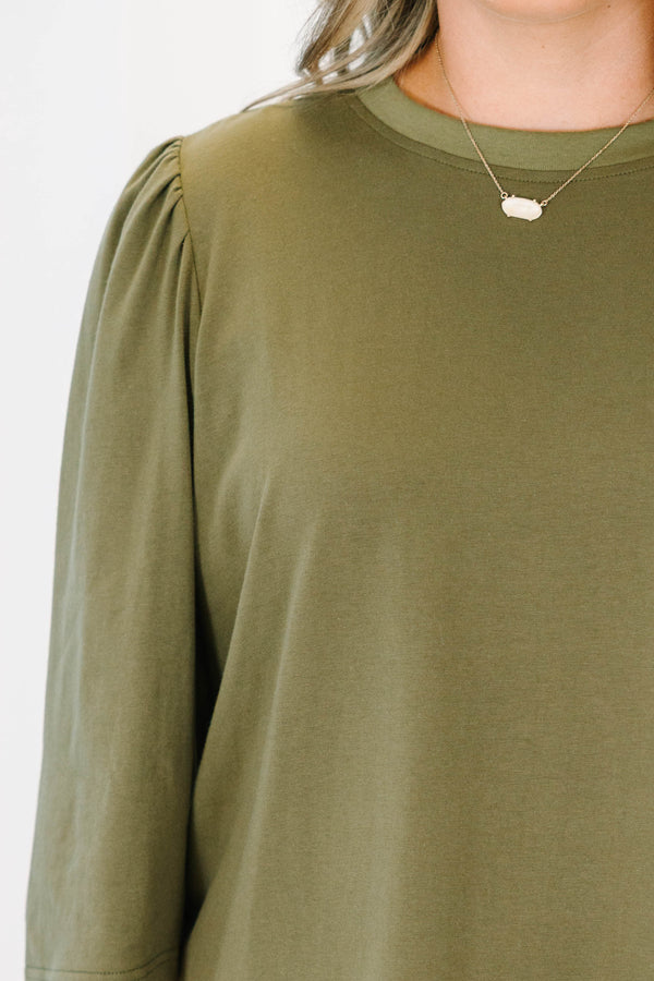 Plus size olive green top with puff sleeves and a relaxed fit