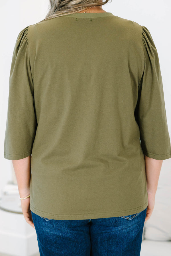 Plus size olive green top with puff sleeves and a relaxed fit