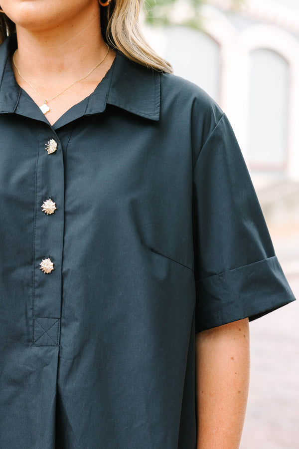 Plus Size black short sleeve top with a collar and gold starburst buttons.