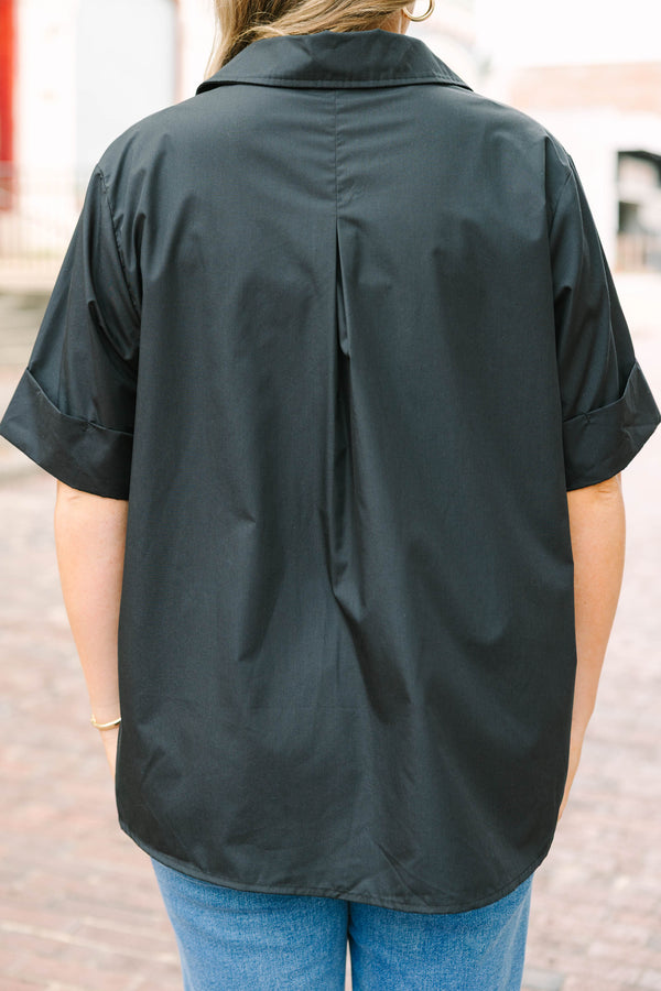 Plus Size black short sleeve top with a collar and gold starburst buttons.