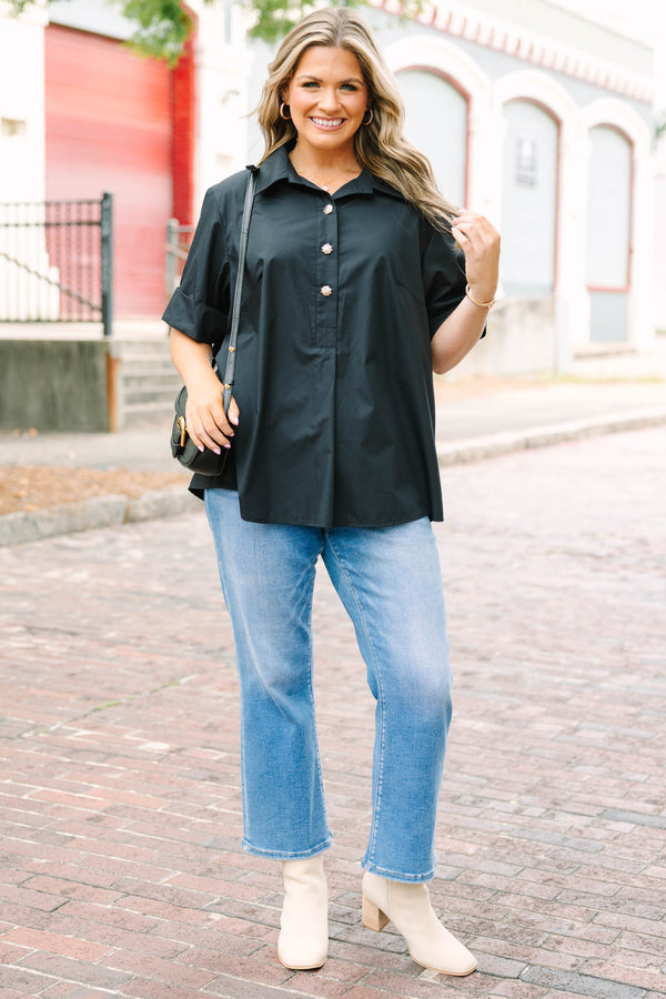 Plus Size black short sleeve top with a collar and gold starburst buttons.