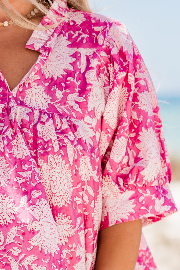 Plus Size pink floral cotton dress with puffed short sleeves, a v-neckline, and a relaxed fit.