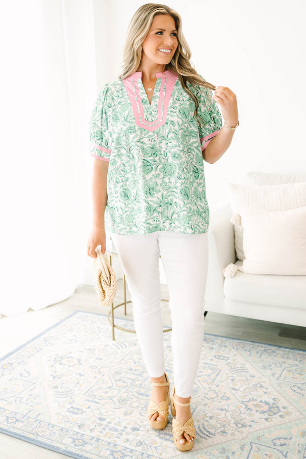 Plus Size green and white floral print top with pink trim, split neckline, and puff sleeves.