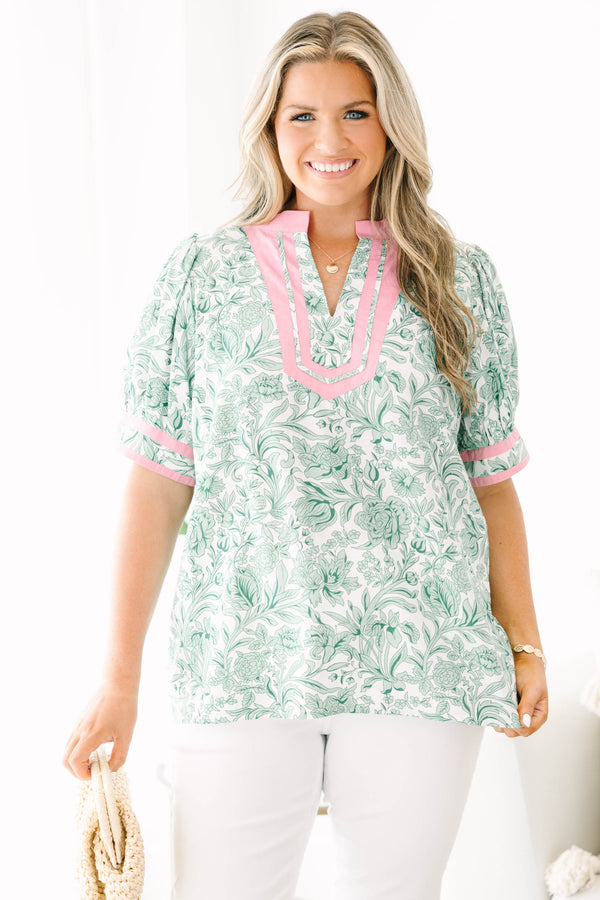 Plus Size green and white floral print top with pink trim, split neckline, and puff sleeves.