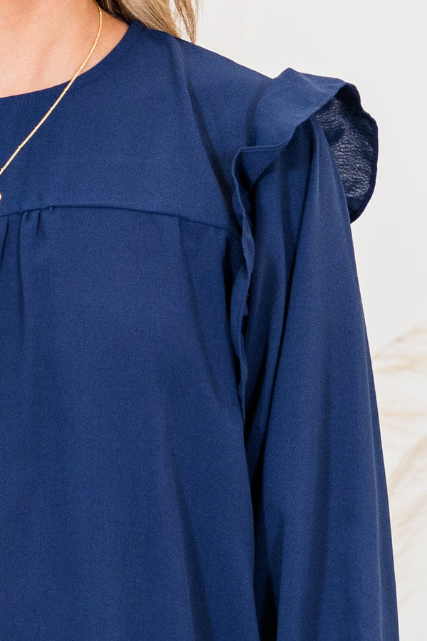 Chic Soul plus size clothing, navy long sleeve flowy long sleeve top with round neckline and bubble cuff sleeves with ruffle detail on shoulders