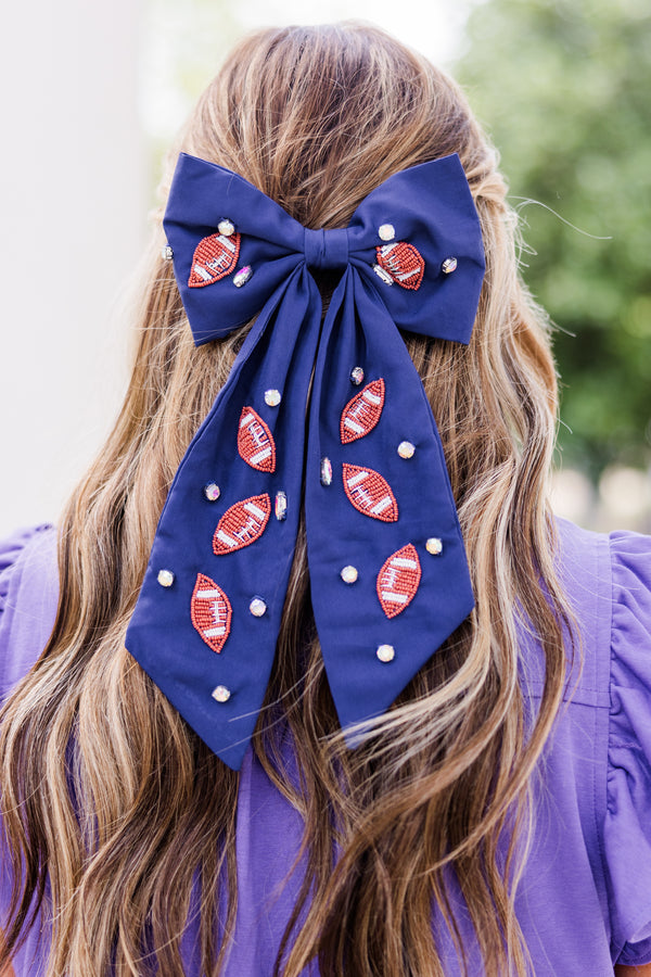 Chic Soul plus size clothing, navy blue hair bow with football patches and gemstones scattered across bow 
