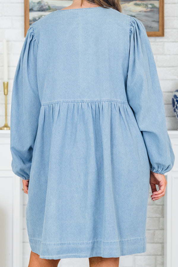 Plus Size light denim babydoll dress with a split v-neck, front bow details, and balloon sleeves.