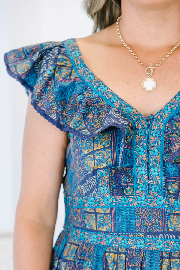 Plus Size purple and blue patterned tiered maxi dress with ruffle cap sleeves and a V-neckline.