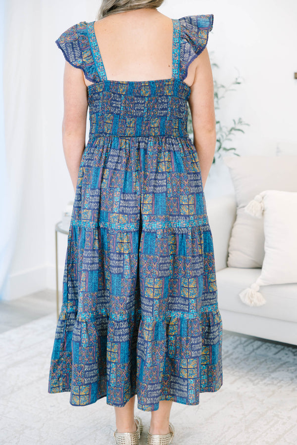 Plus Size purple and blue patterned tiered maxi dress with ruffle cap sleeves and a V-neckline.