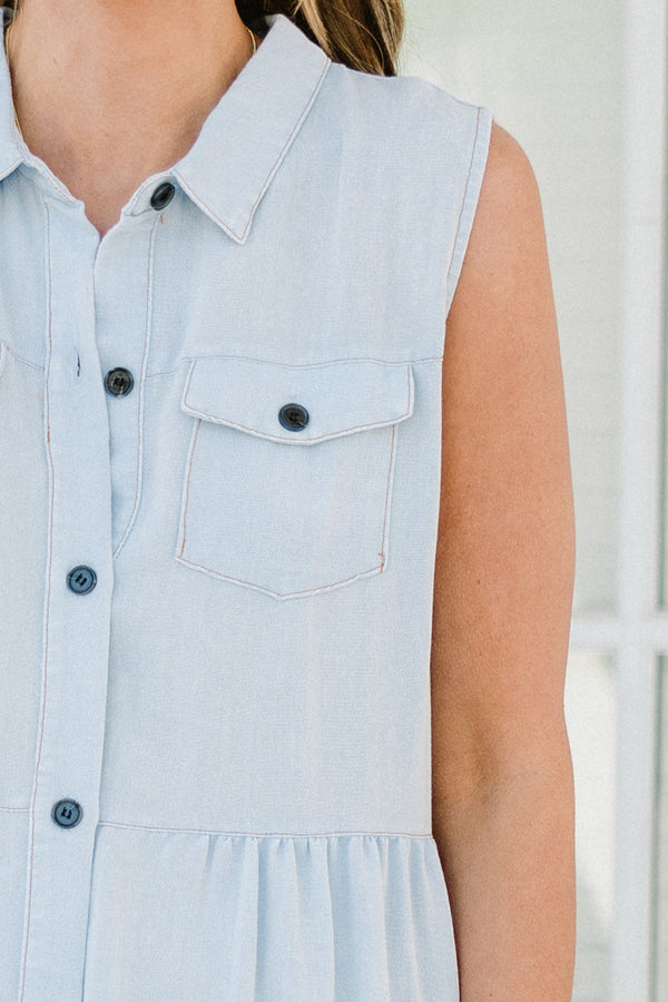 Chic Soul plus size clothing, sleeveless light denim blue ruffled baby doll dress with a collar and black button detailing with subtle fraying along the hemline 