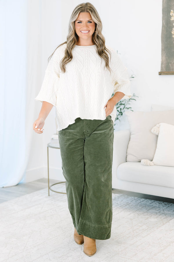 Plus Size moss green wide-leg corduroy pants with a button fly and front pockets.