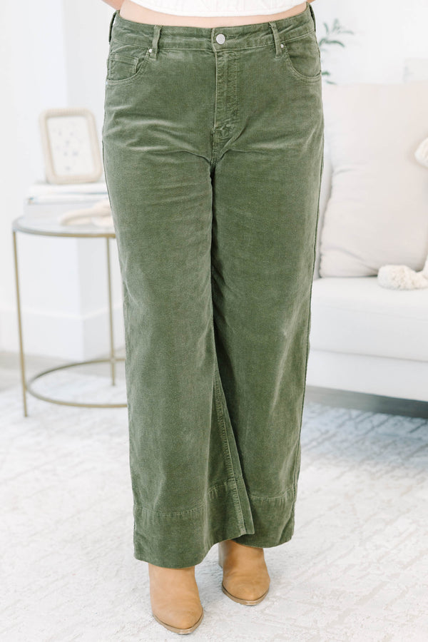 Plus Size moss green wide-leg corduroy pants with a button fly and front pockets.