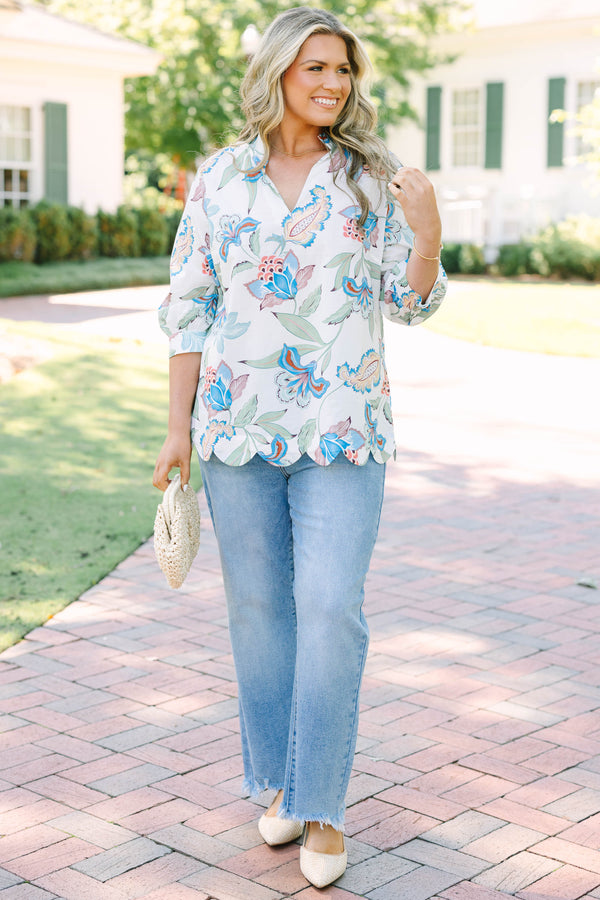 Plus Size white v-neck top with blue and pink floral paisley print, 3/4 sleeves, and scalloped hem.
