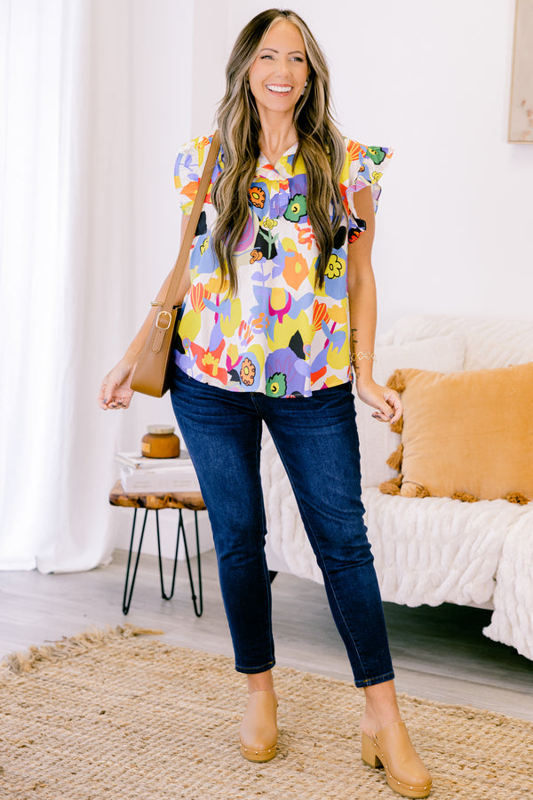 Chic Soul plus size clothing, white top with bold multicolor abstract pattern and flutter sleeves