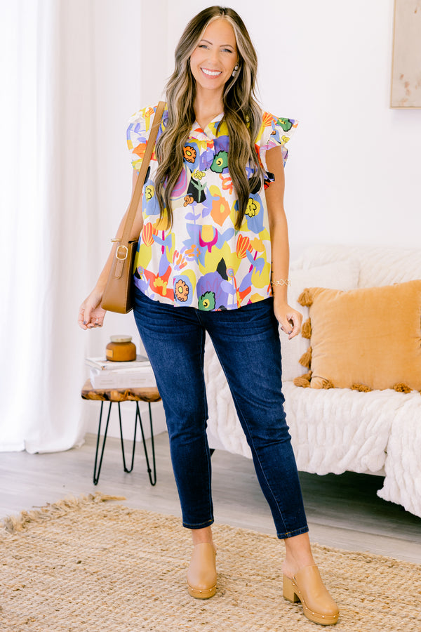 Chic Soul plus size clothing, white top with bold multicolor abstract pattern and flutter sleeves