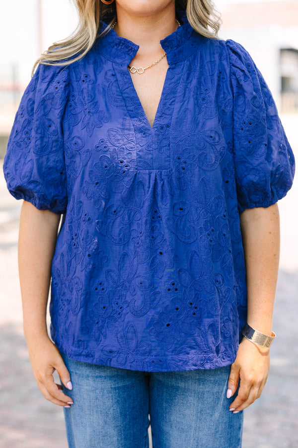 Plus Size navy blue embroidered blouse with puff sleeves and a split neckline.