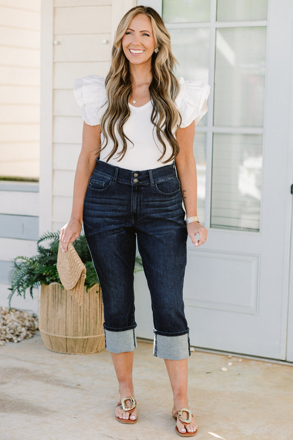 Chic Soul plus size clothing, mid-waisted dark-wash blue jean capris with a bronze button detailing and a cuffed bottom