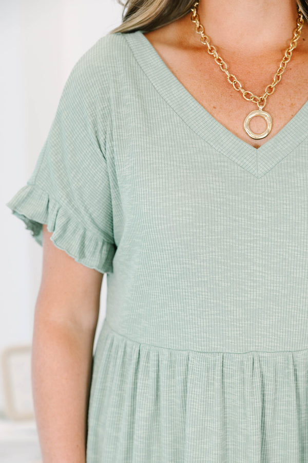Plus Size sea green ribbed knit dress with a V-neckline, ruffled short sleeves, and a tiered skirt.
