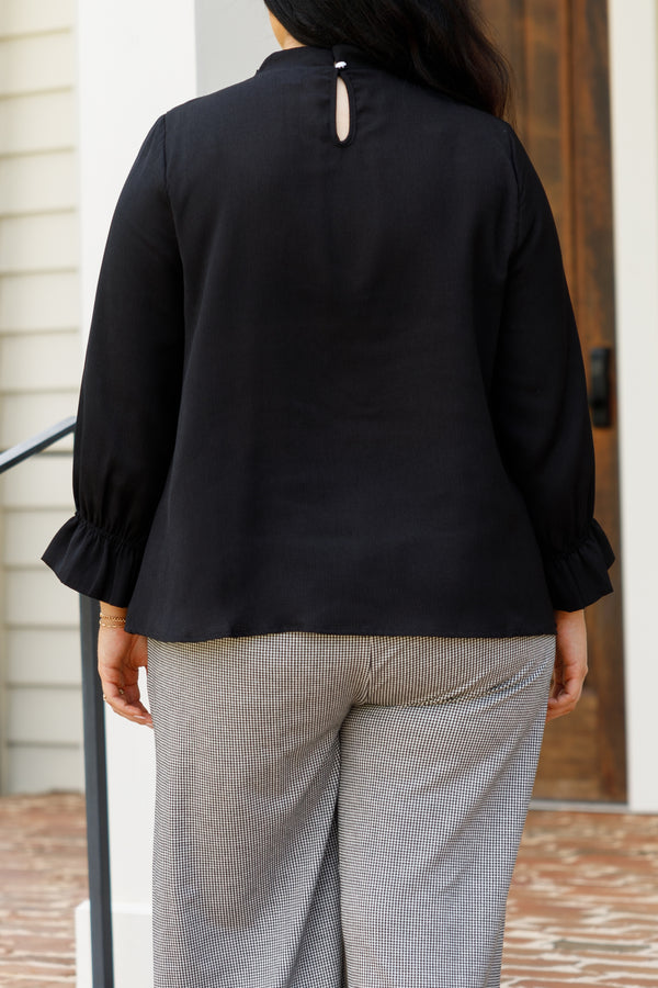 Chic Soul plus size clothing, black top with a high neckline and bubble sleeves