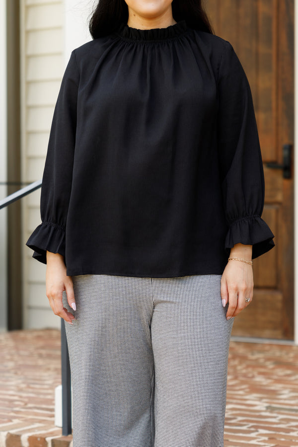 Chic Soul plus size clothing, black top with a high neckline and bubble sleeves